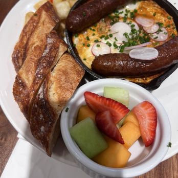 Chaupain Bakery - Shakshouka de Tunis $16 with sausage and fruit. - Breakfast & Brunch Near Me - Laguna Niguel, California Chaupain Bakery - Shakshouka de Tunis $16 with sausage and fruit. - Breakfast & Brunch Near Me - Laguna Niguel, California