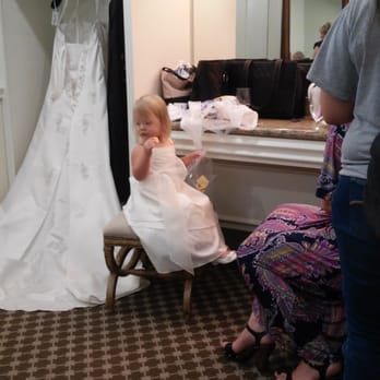 Ashton Gardens West Houston - The flower girl sitting by the vanity area, and where clothes, and dress can be hung. - Wedding Planning Near Me - Houston, Texas