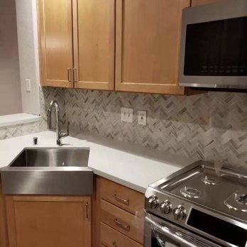 Cruz A+ Remodeling - Kitchen remodel: new quartz slab countertops, stainless steel corner farmhouse sink, marble tile full backsplash, new appliances. - Countertop Installation Near Me - Hayward, California