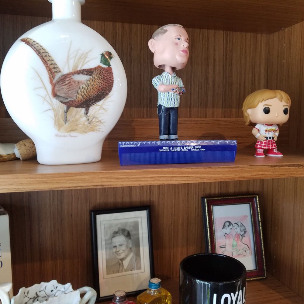 The blue comb is from my grandfather's barbershop. I am proud that they display it at a barbershop that honors the barbers who came before. The blue comb is from my grandfather's barbershop. I am proud that they display it at a barbershop that honors the barbers who came before.