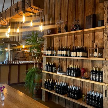 Maison la Belle Vie Winery - Display of wines; love e the lighting! - Wineries Near Me - Palisade, Colorado Maison la Belle Vie Winery - Display of wines; love e the lighting! - Wineries Near Me - Palisade, Colorado