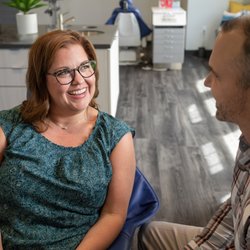 Floyd Family Orthodontics - Happy Valley - Dr. Floyd talking with a mother.