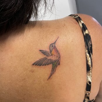 The Ink House - Hummingbird tattoo with color (red yellow throat and green tail ) - Tattoo Near Me - Ventura, California The Ink House - Hummingbird tattoo with color (red yellow throat and green tail ) - Tattoo Near Me - Ventura, California
