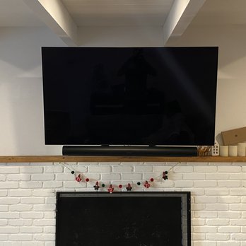 Handy Services - TV mounted above fireplace - Handyman Near Me Handy Services - TV mounted above fireplace - Handyman Near Me