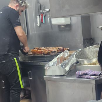 Bota Feijão - Suckling pig being cut up in the kitchen - Portuguese Near Me - Lisbon, 11