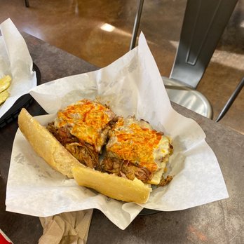 Dill's Deli & Bbq - a sub sandwich on a table - Delis Near Me - Redding, California Dill's Deli & Bbq - a sub sandwich on a table - Delis Near Me - Redding, California