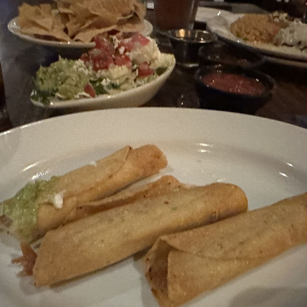 Crispy Chicken Flautas toppings on the side Crispy Chicken Flautas toppings on the side