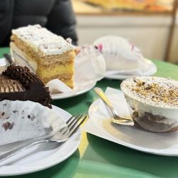 Chocolate cake, pistachio tiramisu, mixed fruit cake, and napoleon