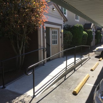 Accessible Comforts - a car parked in front of a building - General Contractors Near Me