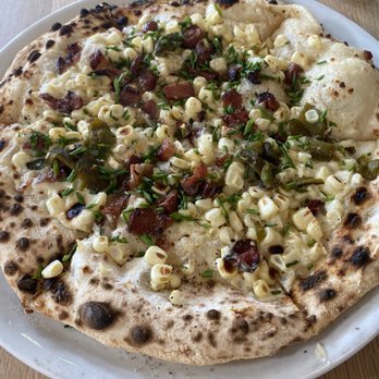 Margot’s Nola - Alabama's finest corn pizza-- coconut crema, sweet corn, poblano, bacon, quadrello di bufala. - Pizza Near Me - New Orleans, Louisiana Margot’s Nola - Alabama's finest corn pizza-- coconut crema, sweet corn, poblano, bacon, quadrello di bufala. - Pizza Near Me - New Orleans, Louisiana