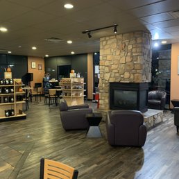 seating area with stone fireplace