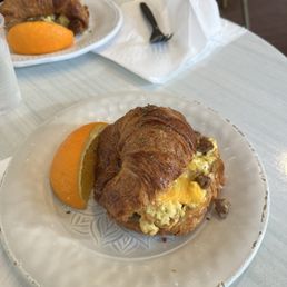 Breakfast Sandwich Eggs, sausage and cheddar on a buttery croissant