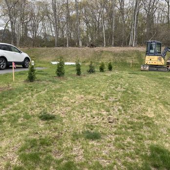 Colonel Landscaping - a car parked in a field - Landscaping Near Me - Oakdale, Connecticut