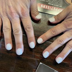 Hi-tek nails - Messy, uneven, thick & hurried...worst nail service I've ever had in my life.