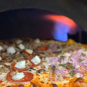June Pie Pizza - a pizza being cooked in a pizza oven - Pizza Near Me - June Lake, California June Pie Pizza - a pizza being cooked in a pizza oven - Pizza Near Me - June Lake, California