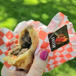 Sheesh Shawarma - Authentic beef Shawarma with pickles, tomatoes on Saj bread