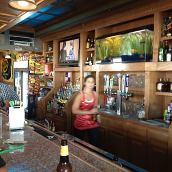 Escape Lounge - a woman standing at the bar - Lounges Near Me - Johnston, Iowa