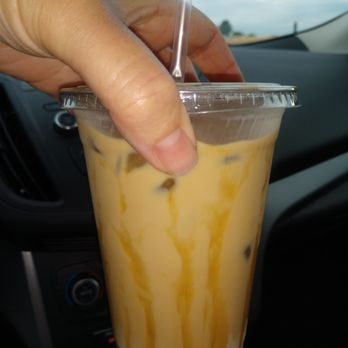 Dee's Coffee Coop - a hand holding a cup of coffee - Coffee & Tea Near Me - Parker, Colorado