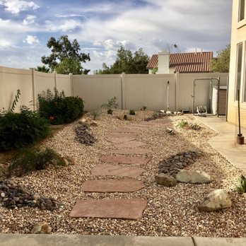 Exterior Imaginations Landscaping - a gravel path in a backyard - Landscaping Near Me