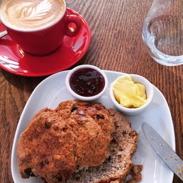 Scone, butter, jam, flat white