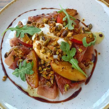 FlintCreek Cattle - Prosciutto with buffalo milk burrata, nectarines, pistachio oil, saba, arugula, sea salt. Incredible!! - New American Near Me - Seattle, Washington FlintCreek Cattle - Prosciutto with buffalo milk burrata, nectarines, pistachio oil, saba, arugula, sea salt. Incredible!! - New American Near Me - Seattle, Washington
