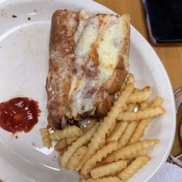 1/2 of a chicken parm sandwich and fries