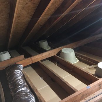 Home Insulation Experts - Installing light covers on top of recessed lights to eliminate air leaks and increase energy efficiency. - Insulation Installation Near Me