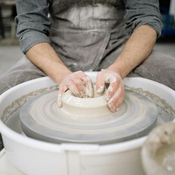 Claya - A potter make a vase during a pottery class at Claya Pottery Studio - Art Classes Near Me - Denver, Colorado Claya - A potter make a vase during a pottery class at Claya Pottery Studio - Art Classes Near Me - Denver, Colorado