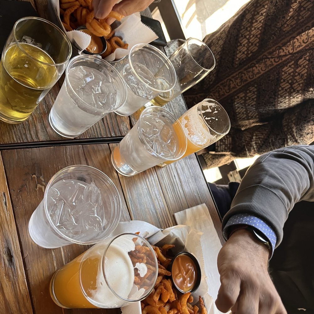 Second District Brewing - a table full of beer and snacks - Breweries Near Me - Philadelphia, Pennsylvania Second District Brewing - a table full of beer and snacks - Breweries Near Me - Philadelphia, Pennsylvania