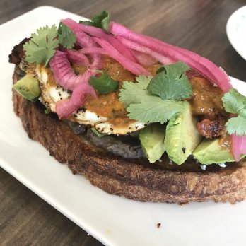 2 Birds Coffee - Chorizo Fancy Toast with avocado, black bean spread, sunny side eggs, salsa, pickled onions, cilantro & queso fresco. SO GOOD !! - Coffee & Tea Near Me - Miramar Beach, Florida