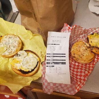 Ron's Drive-In - My poorly made order before they fixdx it.Both of these burgers are the same exact size but the Big r is more money. - Burgers Near Me - Spokane Valley, Washington