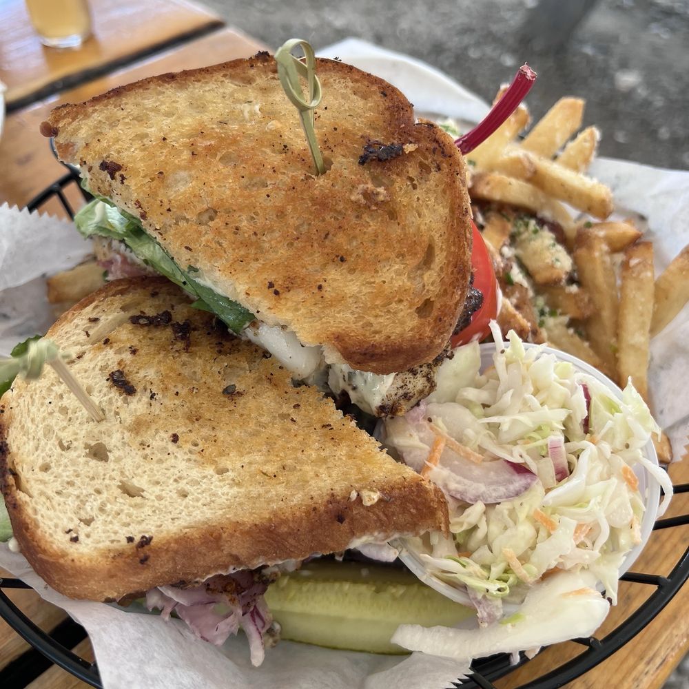 Shuck Station - Blackened fish sandwich with station fries and coleslaw. - Seafood Near Me - Newcastle, Maine