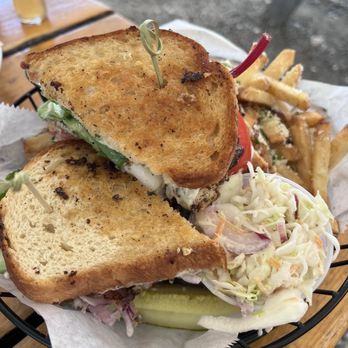 Shuck Station - Blackened fish sandwich with station fries and coleslaw. - Seafood Near Me - Newcastle, Maine Shuck Station - Blackened fish sandwich with station fries and coleslaw. - Seafood Near Me - Newcastle, Maine