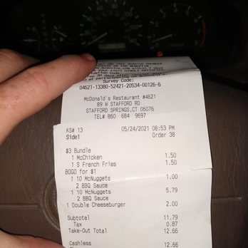 McDonald's - a hand holding a receipt - Fast Food Near Me - Stafford Springs, Connecticut