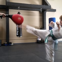 Revolution ryu - Cannon Starritt, age 6 doing a round house kick at Revolution Ryu dojo.
