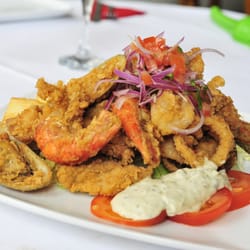 Tito's - JALEA - A Peruvian dish which includes Fried Battered King Prawns, Cod, Mussels & Squid. Served with Fried Cassava & Tartar Sauce.