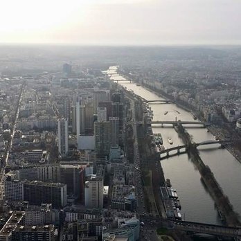 Statue de la Liberté - The view of the Statue from the Eiffel Tower; the Statue is at the far end of the manmade island in the Seine. - Local Flavor Near Me - Paris, 75