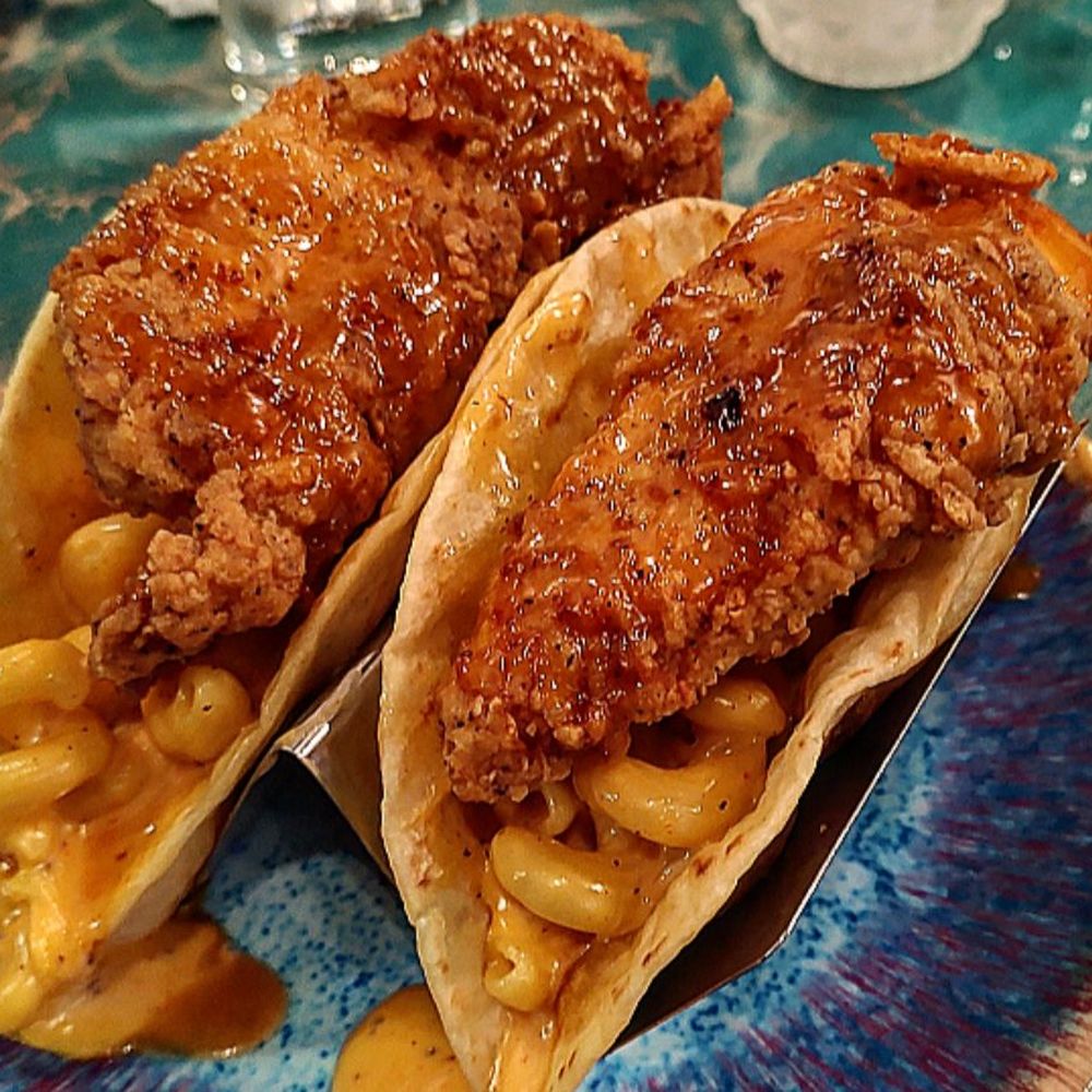 CCB Bistro & Vine - Chicken tenderloin tacos on a bed of Mac and cheese with a honey siracha sauce - Wine Bars Near Me - Rock Hill, South Carolina