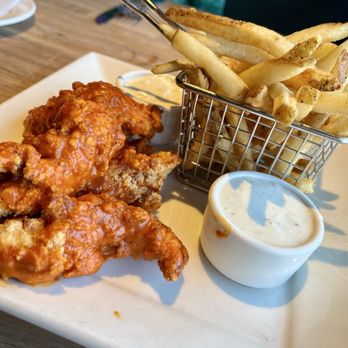 Yard House - Hand-Battered Chicken Tenders tossed in buffalo sauce - Vegetarian Near Me - Burbank, California Yard House - Hand-Battered Chicken Tenders tossed in buffalo sauce - Vegetarian Near Me - Burbank, California