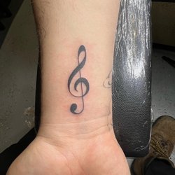 Dragons Lair Tattoo Studio - Clef note by Brandon Lee! @dragonslairtattoo!