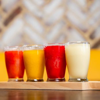 The Spot - a row of glasses of different drinks - Burgers Near Me - League City, Texas The Spot - a row of glasses of different drinks - Burgers Near Me - League City, Texas