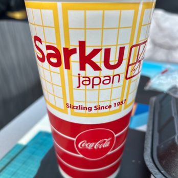 Sarku Japan - a plastic cup with a straw sticking out of it - Japanese Near Me - Frisco, Texas Sarku Japan - a plastic cup with a straw sticking out of it - Japanese Near Me - Frisco, Texas