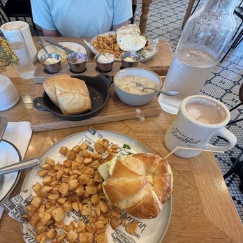 Magnolia Table - Biscuits and Jo's Buttermilk Biscuits with Sausage Gravy (4), biscuit, and Butter flight, sausage breakfast Croissant, hot chocolate - Breakfast & Brunch Near Me - Waco, Texas