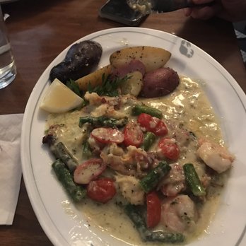 Phillips Seafood - Chefs chicken specialty with Parmesan cream sauce bacon asparagus and tomatoes. - Seafood Near Me - Baltimore, Maryland Phillips Seafood - Chefs chicken specialty with Parmesan cream sauce bacon asparagus and tomatoes. - Seafood Near Me - Baltimore, Maryland