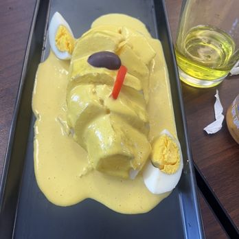 Peru Puro Sabor - Papa à la huancaina (creamy mildly spiced cheese sauce) try it with the rocoto and spicy green sauce! If you like spicy! - Peruvian Near Me - Davie, Florida