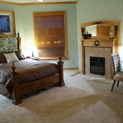 Fisher House Bed and Breakfast - Annabelle's room features a queen bed and fireplace that can be used year round.