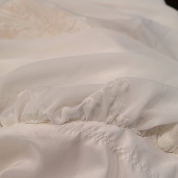 Bluebird Bridal - The runs in the fabric, the sewing machine bobbin is not threaded properly, pulling the material, untrained seamstress sewing. - Bridal Near Me - Huntersville, North Carolina Bluebird Bridal - The runs in the fabric, the sewing machine bobbin is not threaded properly, pulling the material, untrained seamstress sewing. - Bridal Near Me - Huntersville, North Carolina