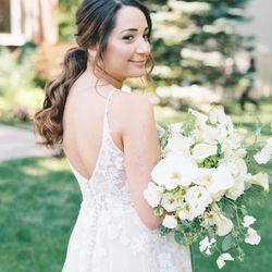 Fleurissimo - The brides had ivory and green bouquets with plenty of lush florals and greenery of different sizes and tones