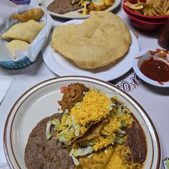 Brown Mug Cafe - Three Item Combination plate with two tacos, enchilada, beans and rice.. Indian Fry bread in the center of the table.. - Mexican Near Me - Winslow, Arizona Brown Mug Cafe - Three Item Combination plate with two tacos, enchilada, beans and rice.. Indian Fry bread in the center of the table.. - Mexican Near Me - Winslow, Arizona