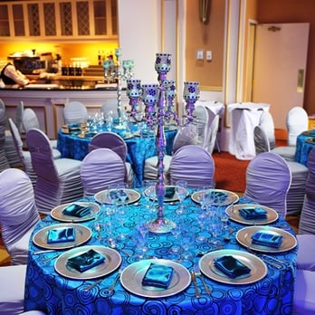 Classic Chair Covers - Speciality Table Cloth/Linen, Silver Charger Plates, Blue Satin Napkins, and Candelabra - Party Supplies Near Me - Toronto, Ontario Classic Chair Covers - Speciality Table Cloth/Linen, Silver Charger Plates, Blue Satin Napkins, and Candelabra - Party Supplies Near Me - Toronto, Ontario
